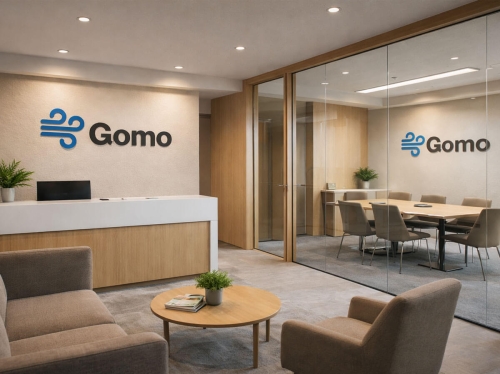Gomo logó és vállalati arculat modern iroda recepciós falán