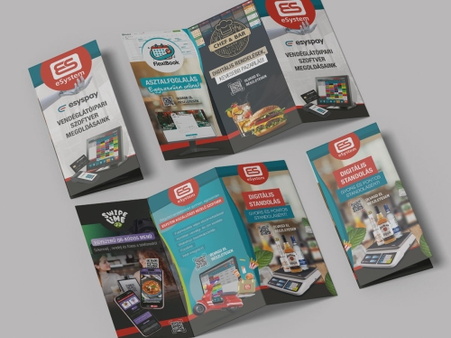 eSystem nyomdai és digitális kiadványok felülnézeti bemutatása egységes arculati grafikai tervezéssel